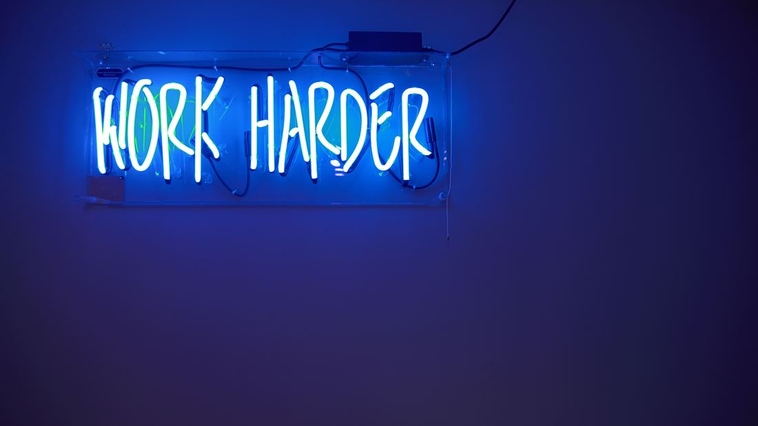 Work harder neon sign by Jordan Whitfield